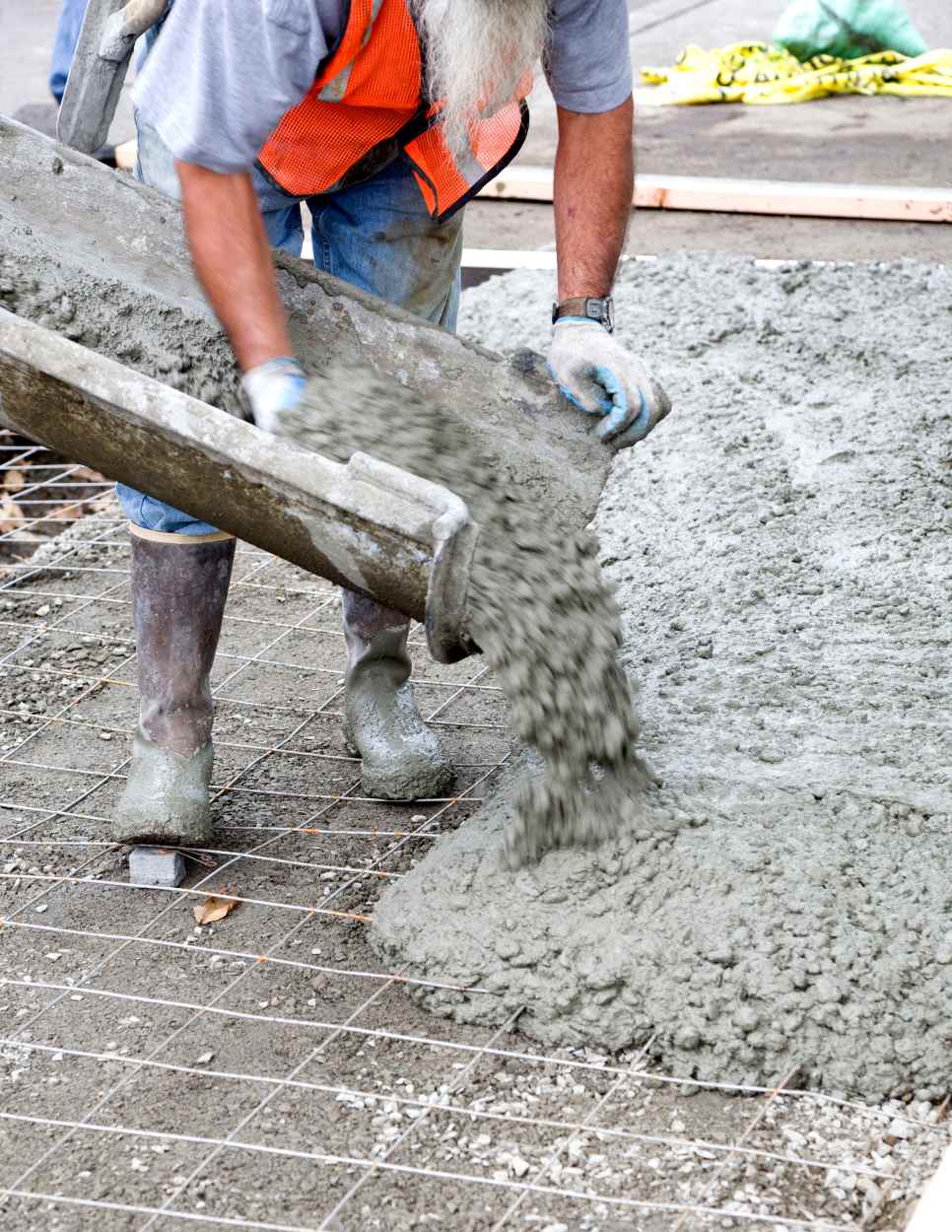 Man pouring cement from truck