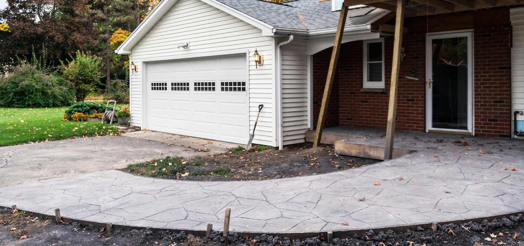Cement driveway and patio with cement path