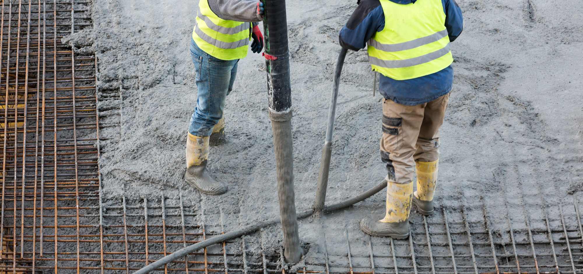 men pouring cement